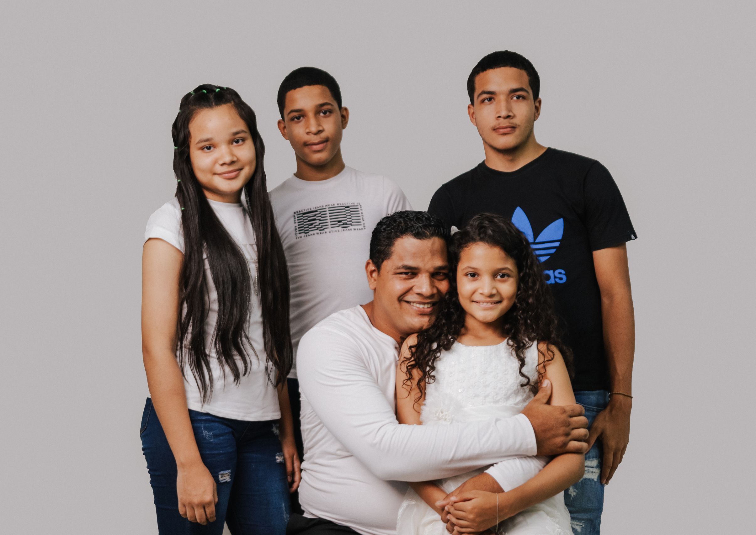 Family group portrait at storefront
